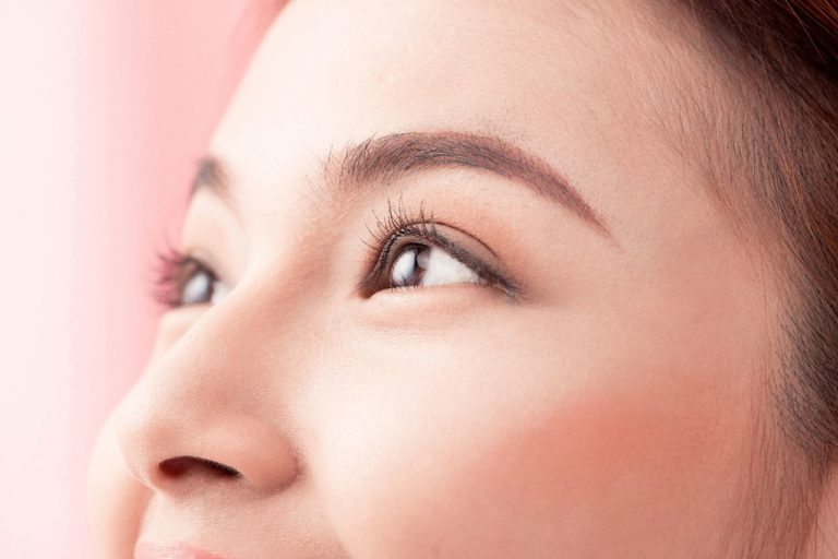 The face of a woman to showcase eyebrow embroidery for Demystifying the Microblading Trend blog banner
